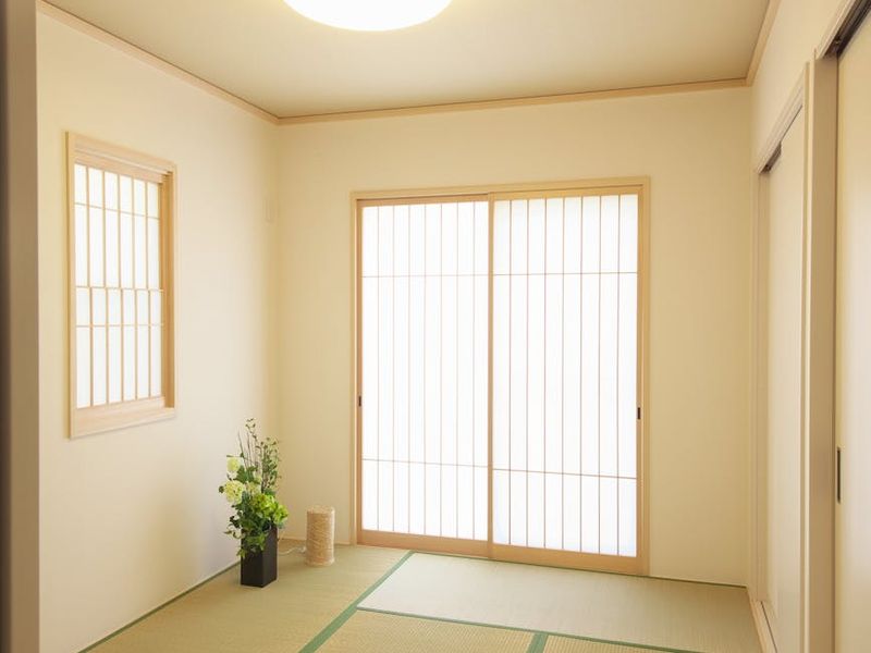 Spacious, clean room with a mat, suitable for home workouts.